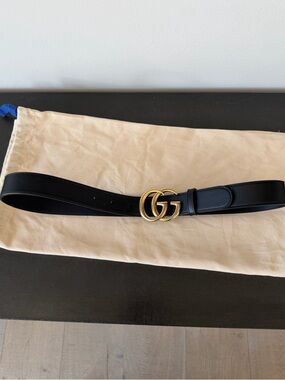 Gucci black leather belt.